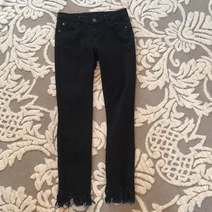 Black denim fringe jeans